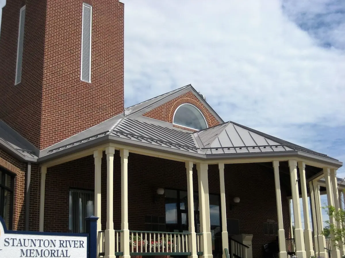 Skilled roofing craftsmen working on a residential roof in Union Springs